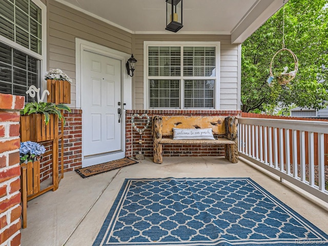 8010 Raspberry Dr, Frederick, CO 80504 - property entrance with a porch and brick siding