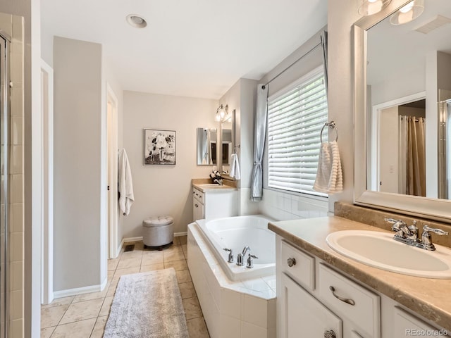 8010 Raspberry Dr, Frederick, CO 80504 - full bathroom featuring two vanities, a bath, a shower, tile patterned floors, and baseboards