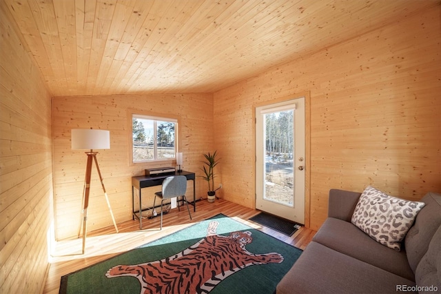 interior space featuring hardwood / wood-style floors, wooden ceiling, and vaulted ceiling