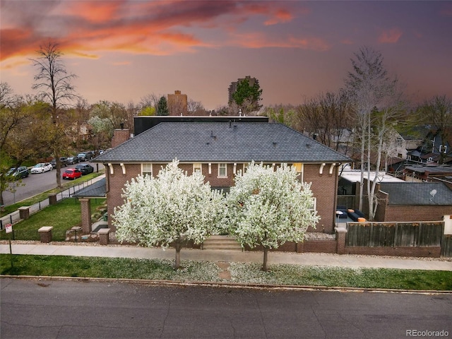 201 S Lafayette St, Denver, CO 80209 - view of front of house with a chimney and brick siding