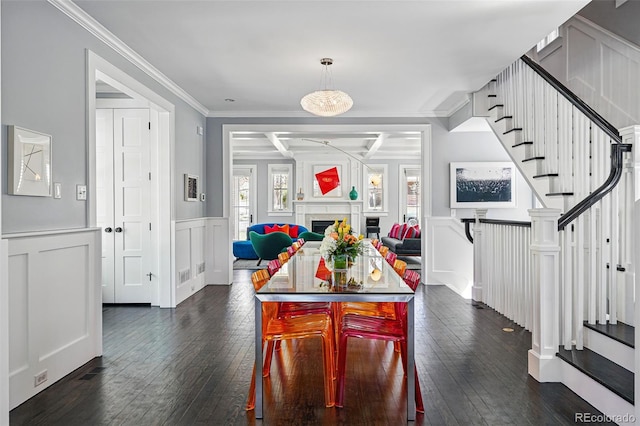 201 S Lafayette St, Denver, CO 80209 - dining room with a decorative wall, stairs, dark wood-type flooring, wainscoting, and ornamental molding