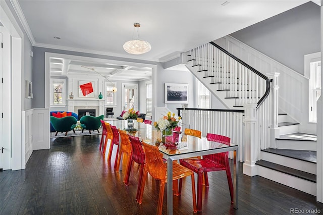 201 S Lafayette St, Denver, CO 80209 - dining area with hardwood / wood-style floors, stairway, crown molding, a fireplace, and a decorative wall