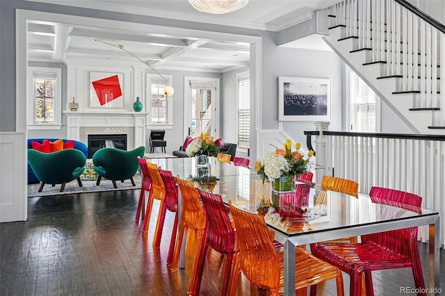 201 S Lafayette St, Denver, CO 80209 - dining room featuring coffered ceiling, dark wood-style floors, a fireplace, a decorative wall, and ornamental molding