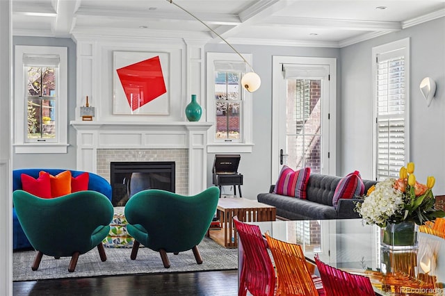 201 S Lafayette St, Denver, CO 80209 - living room featuring beam ceiling, healthy amount of natural light, wood finished floors, a tile fireplace, and crown molding