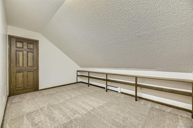 bonus room featuring lofted ceiling, a textured ceiling, light colored carpet, baseboards, and baseboard heating