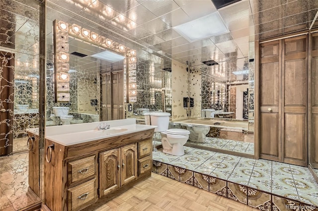 full bathroom featuring vanity and toilet