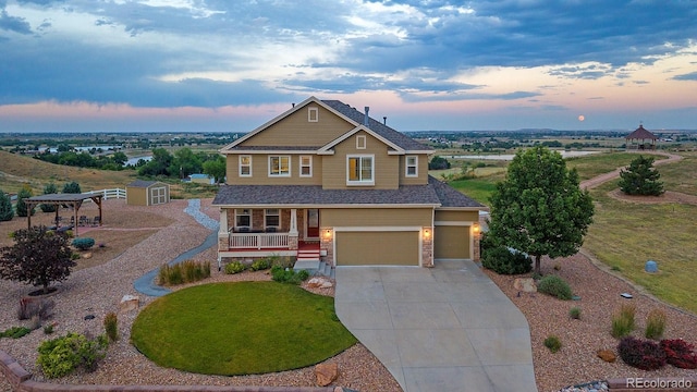 12420 Verbena St, Thornton, CO 80602 - view of front of property featuring concrete driveway, covered porch, and an attached garage