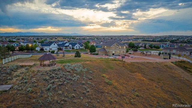 12420 Verbena St, Thornton, CO 80602 - aerial view at dusk of a residential view and a mountain view