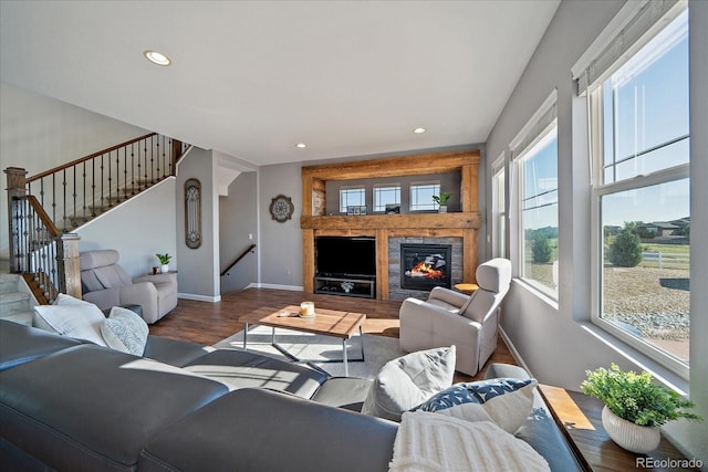 12420 Verbena St, Thornton, CO 80602 - living area featuring wood finished floors, stairway, recessed lighting, and a tile fireplace
