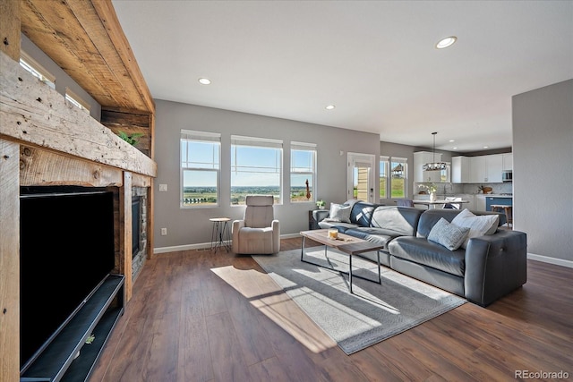 12420 Verbena St, Thornton, CO 80602 - living area featuring recessed lighting, dark wood-type flooring, and a fireplace