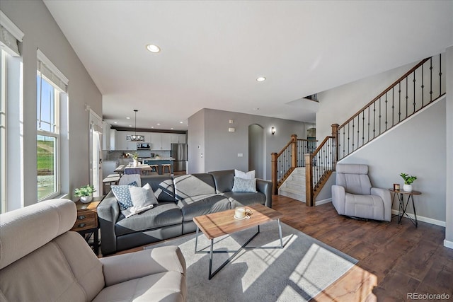 12420 Verbena St, Thornton, CO 80602 - living room featuring dark wood-style floors, stairs, and recessed lighting