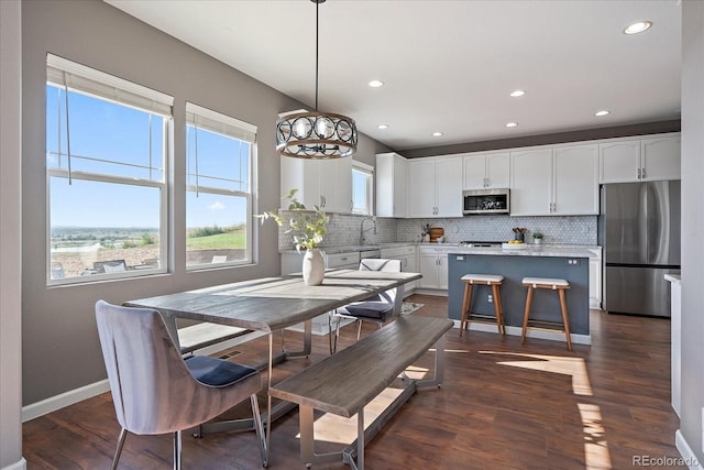 12420 Verbena St, Thornton, CO 80602 - dining area featuring recessed lighting and dark wood-style floors