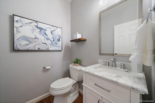 12420 Verbena St, Thornton, CO 80602 - half bathroom featuring wood finished floors and vanity