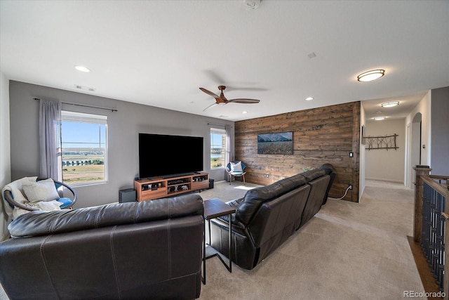 12420 Verbena St, Thornton, CO 80602 - living area featuring light colored carpet, plenty of natural light, ceiling fan, wood walls, and recessed lighting