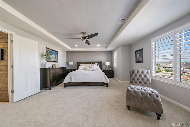 12420 Verbena St, Thornton, CO 80602 - bedroom featuring light colored carpet, recessed lighting, a tray ceiling, and ceiling fan