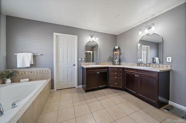 12420 Verbena St, Thornton, CO 80602 - full bath with double vanity, a bath, tile patterned flooring, and a shower with door