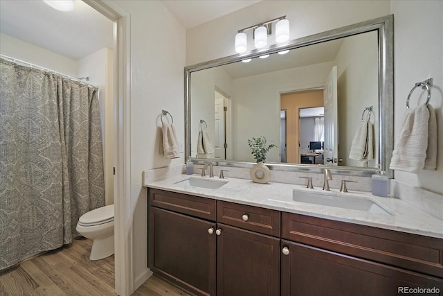 12420 Verbena St, Thornton, CO 80602 - full bath with wood finished floors and double vanity