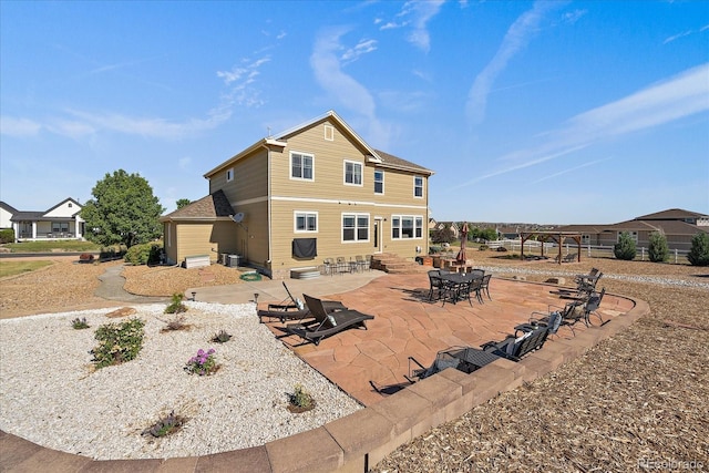 12420 Verbena St, Thornton, CO 80602 - rear view of house featuring entry steps and a patio area
