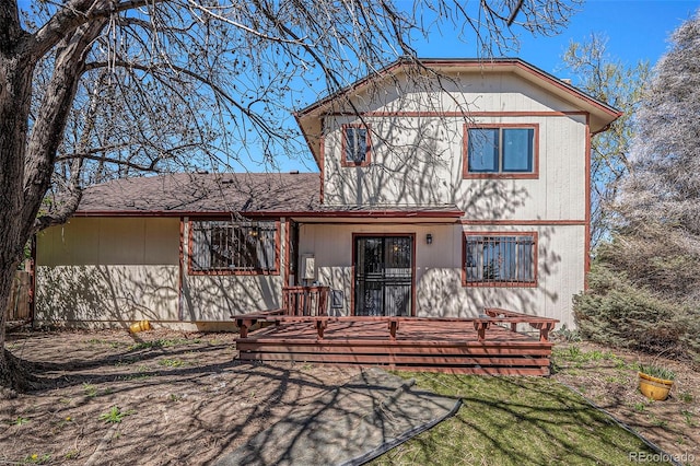 view of front of property featuring a wooden deck