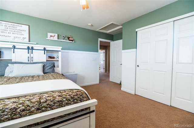 bedroom with ceiling fan, carpet, and a closet