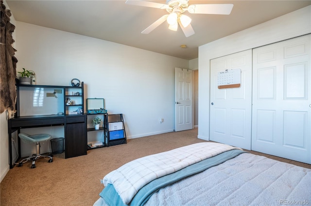 carpeted bedroom featuring a closet and ceiling fan