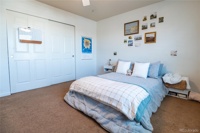 carpeted bedroom with a closet and ceiling fan