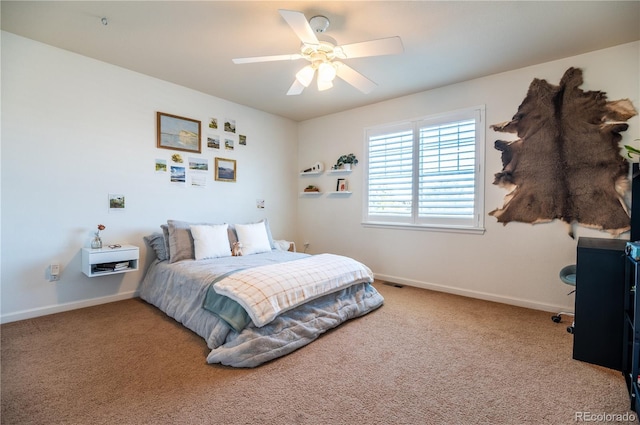 bedroom featuring ceiling fan and carpet