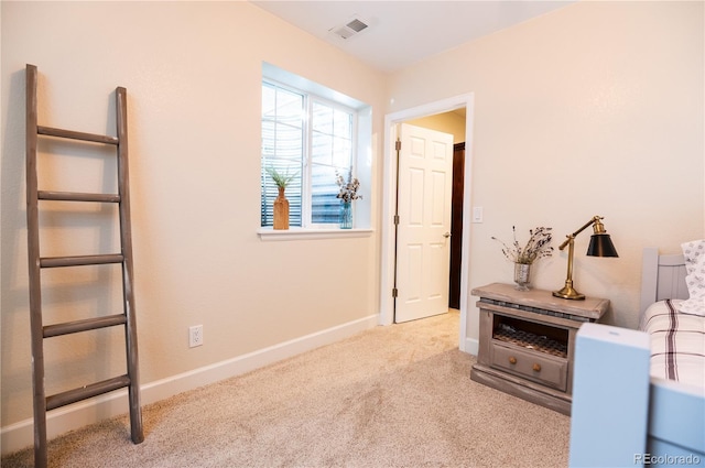 living area featuring light colored carpet