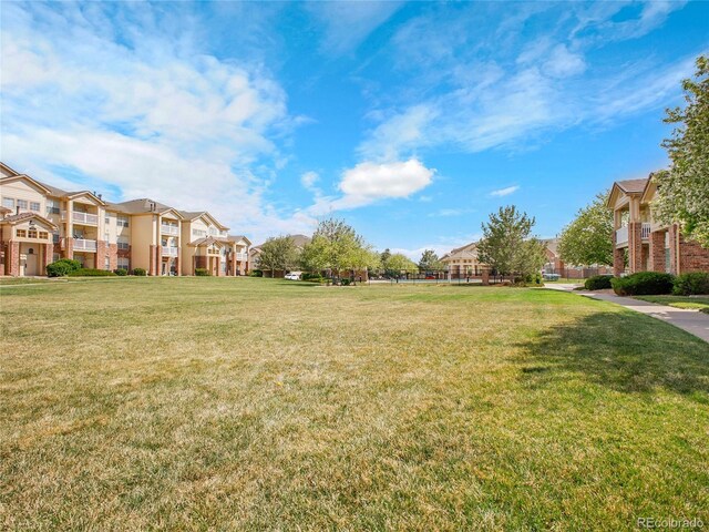 5765 N Genoa Way Unit 1-103, Aurora, CO 80019 - view of green lawn with a residential view