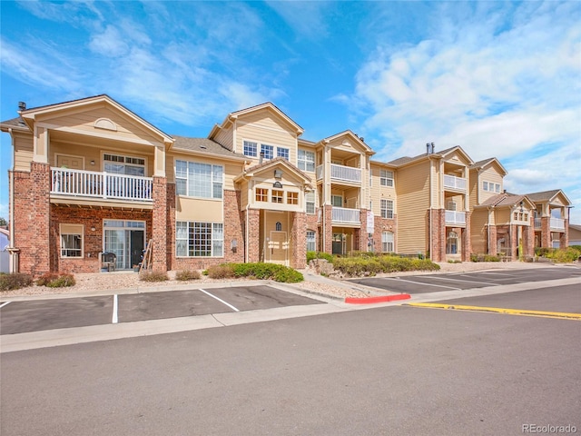 5765 N Genoa Way Unit 1-103, Aurora, CO 80019 - view of property with uncovered parking