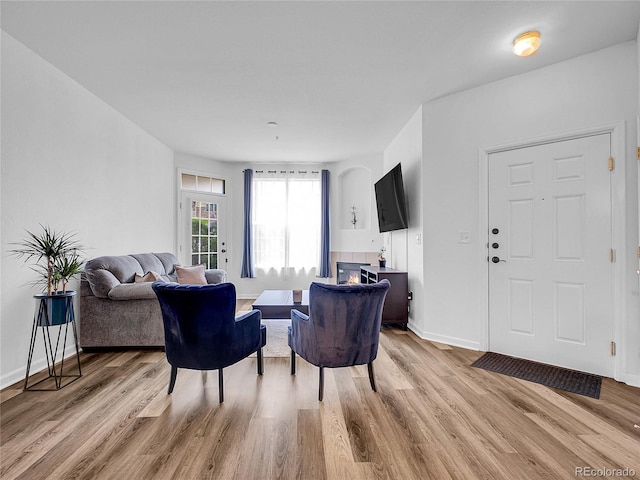 5765 N Genoa Way Unit 1-103, Aurora, CO 80019 - living room with wood finished floors and baseboards