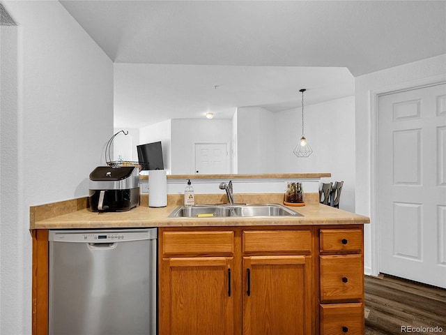 5765 N Genoa Way Unit 1-103, Aurora, CO 80019 - kitchen with stainless steel dishwasher, a sink, light countertops, and dark wood-style flooring