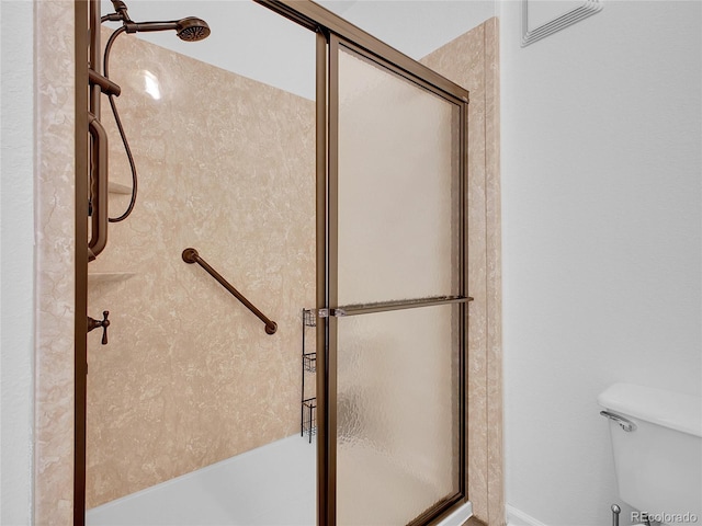 5765 N Genoa Way Unit 1-103, Aurora, CO 80019 - full bathroom with a shower with door and toilet