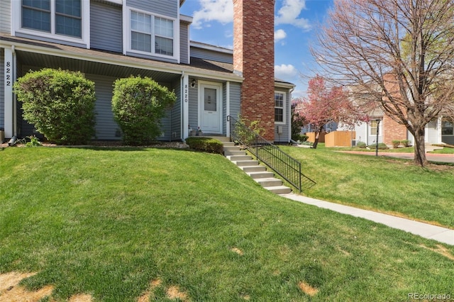 8220 W 90th Pl Unit 2003, Broomfield, CO 80021 - traditional home with a chimney and a front yard