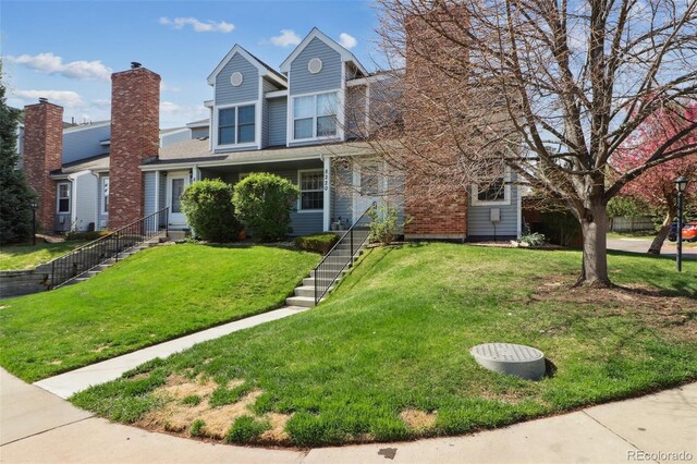 8220 W 90th Pl Unit 2003, Broomfield, CO 80021 - traditional-style house featuring a front lawn and stairs