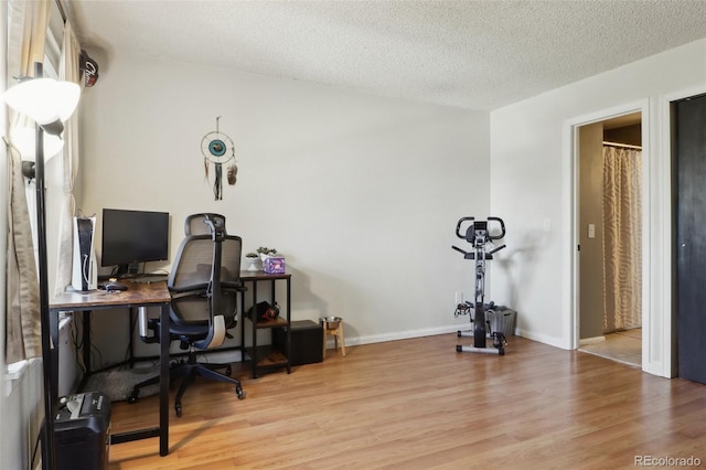 8220 W 90th Pl Unit 2003, Broomfield, CO 80021 - office area with wood finished floors, a textured ceiling, and baseboards