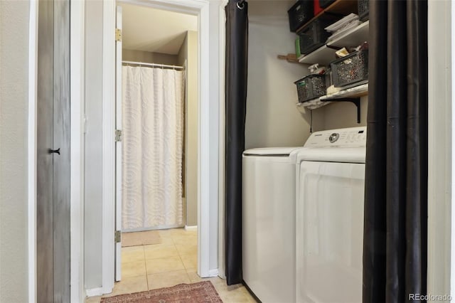 8220 W 90th Pl Unit 2003, Broomfield, CO 80021 - laundry area featuring washer and clothes dryer and light tile patterned flooring