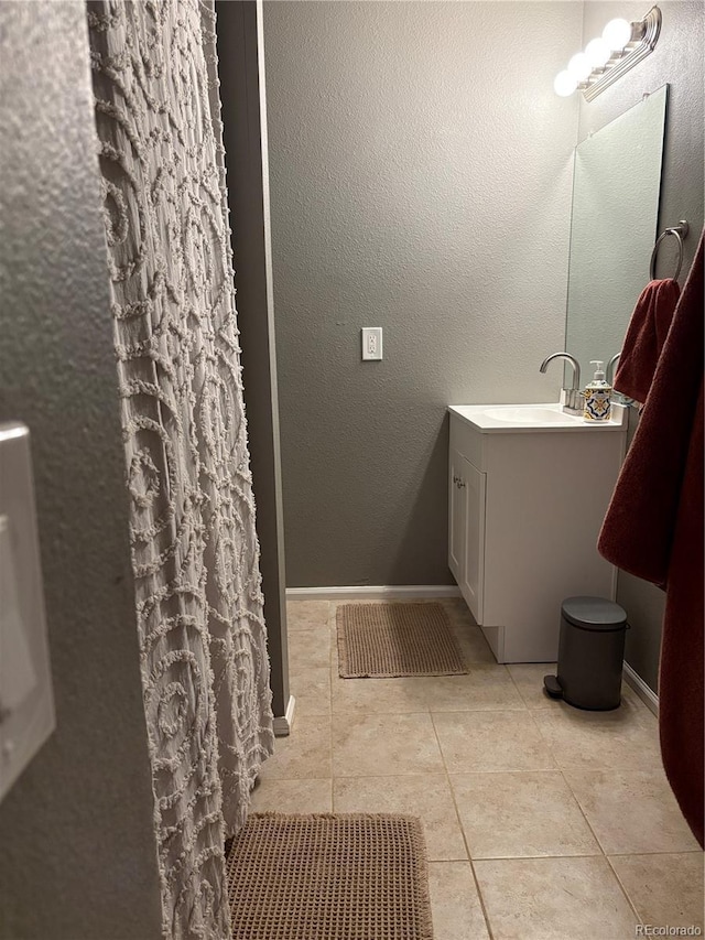 8220 W 90th Pl Unit 2003, Broomfield, CO 80021 - bathroom with vanity, tile patterned flooring, and baseboards