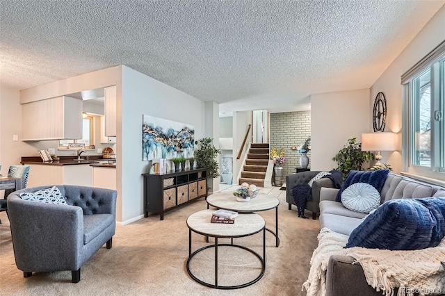 living room with a textured ceiling and light colored carpet