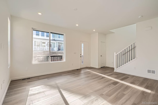 entrance foyer with light hardwood / wood-style flooring