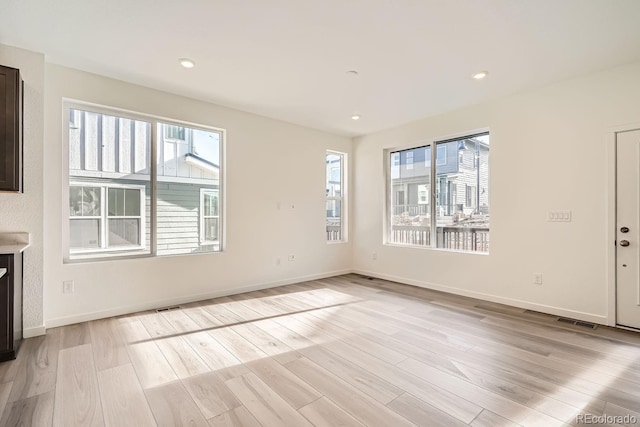 unfurnished living room featuring light hardwood / wood-style flooring