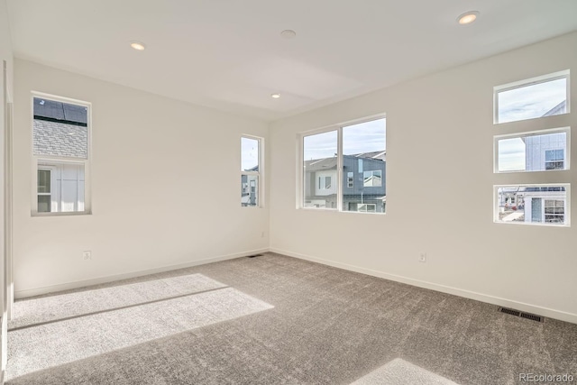 spare room featuring carpet flooring