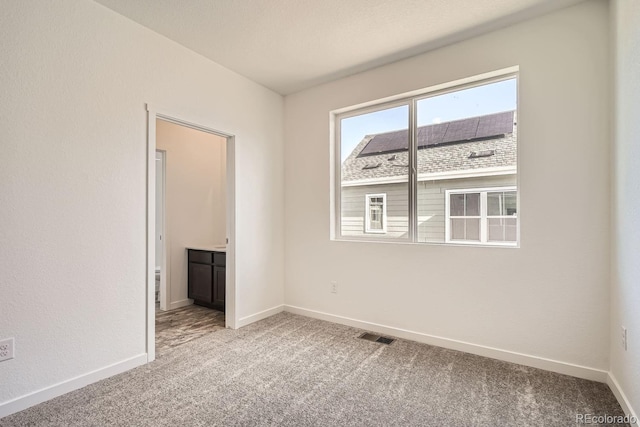 view of carpeted spare room