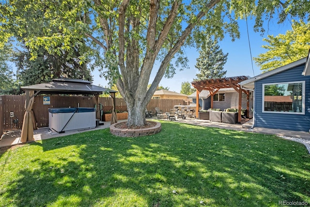 view of yard featuring outdoor lounge area, a pergola, a hot tub, a gazebo, and a patio area