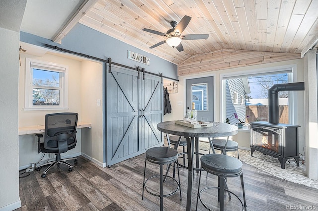 dining area featuring hardwood / wood-style flooring, vaulted ceiling, plenty of natural light, and wooden ceiling