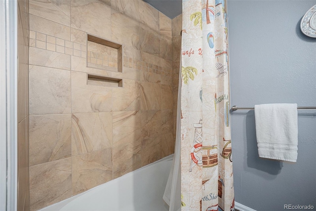 bathroom featuring shower / bath combo with shower curtain