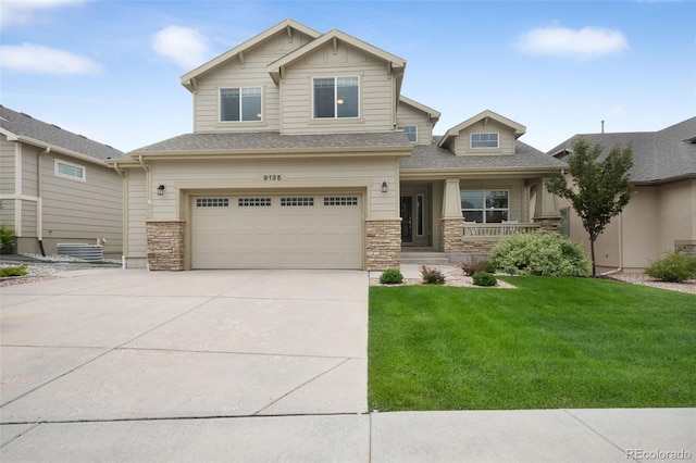 9135 Argentine Pass Trl, Colorado Springs, CO 80924 - craftsman house with covered porch, an attached garage, concrete driveway, a front lawn, and stone siding