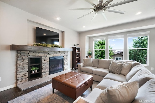 9135 Argentine Pass Trl, Colorado Springs, CO 80924 - living room with wood finished floors, a stone fireplace, ceiling fan, and recessed lighting