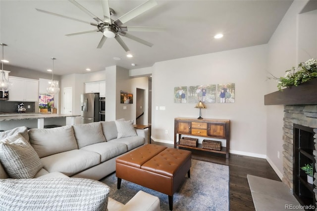 9135 Argentine Pass Trl, Colorado Springs, CO 80924 - living area with dark wood-style flooring, ceiling fan, recessed lighting, and a fireplace