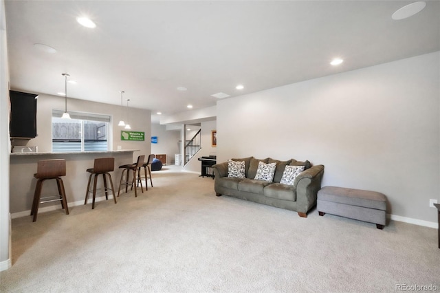 9135 Argentine Pass Trl, Colorado Springs, CO 80924 - living area featuring light carpet, stairs, and recessed lighting